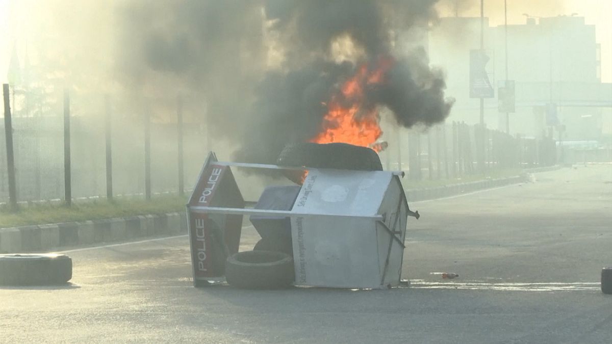 Overturned toll booth on fire