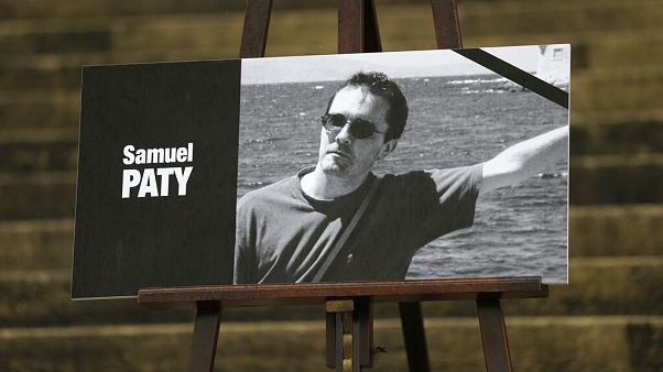 The portrait of slain teacher Samuel Paty with a black ribbon is displayed Tuesday, Oct.20, 2020 on the steps of the National Assembly in Paris. The portrait of slain teacher Samuel Paty with a black ribbon is displayed Tuesday, Oct.20, 2020 on the steps of the National Assembly in Paris.