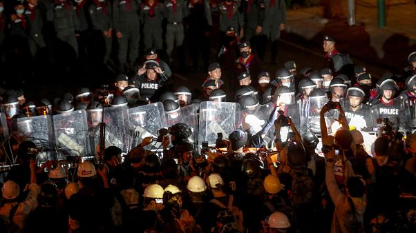 Pro-democracy activists confront a police blockage during their march to the Government House, prime minister's office during a protest march in Bangkok, Thailand, Wednesday, Pro-democracy activists confront a police blockage during their march to the Government House, prime minister's office during a protest march in Bangkok, Thailand, Wednesday,