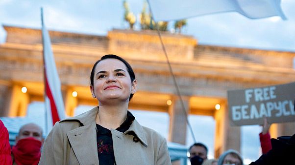 Belarusian opposition leader Svetlana Tikhanovskaya is welcomed by supporters, during a rally, by the Brandenburg Gate in Berlin, Monday, Oct. 5, 2020.