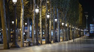 Champs-Elysees avenue is empty during curfew in Paris, Saturday, Oct. 17, 2020.