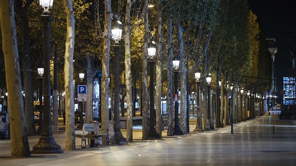 Champs-Elysees avenue is empty during curfew in Paris, Saturday, Oct. 17, 2020. Champs-Elysees avenue is empty during curfew in Paris, Saturday, Oct. 17, 2020.