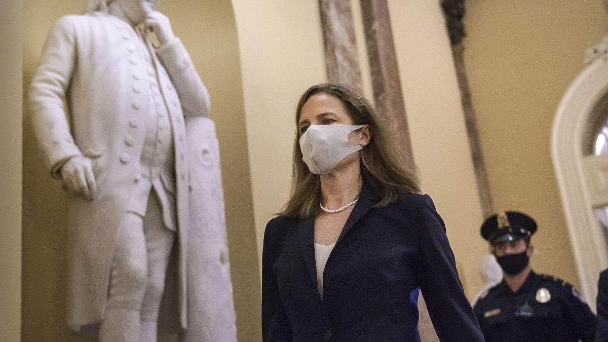 Judge Amy Coney Barrett, President Donald Trump's nominee for the Supreme Court, arrives for closed meetings with senators, at the Capitol in Washington, Wednesday, Oct. 21.