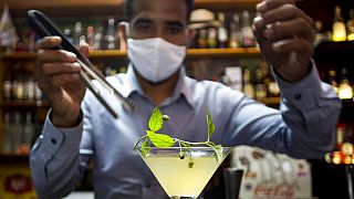 bartender Dagoberto Jesus Morejon prepares a "Martini de Oro," or Golden Martini, a cocktail using a plant endemic to Cuba called the "Orozus de la Tierra." 