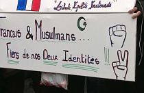 Close-up of a sign saying "French and Muslim, proud of our two identities", during a march against Islamophobia in France