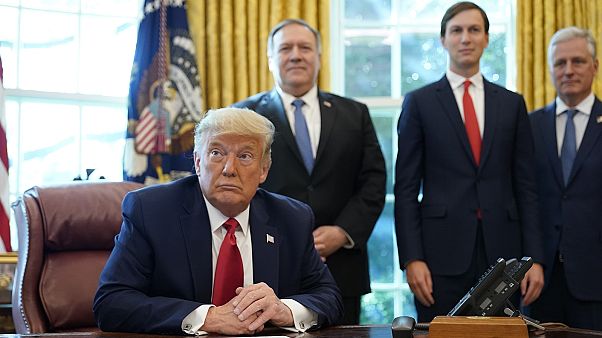 President Donald Trump listens while on a phone call with leaders of Sudan and Israel in the Oval Office of the White House, Friday, Oct. 23, 2020. President Donald Trump listens while on a phone call with leaders of Sudan and Israel in the Oval Office of the White House, Friday, Oct. 23, 2020.