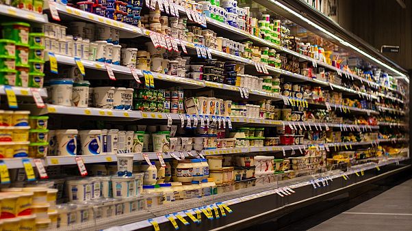 Products line the shelves of a supermarket. Products line the shelves of a supermarket.