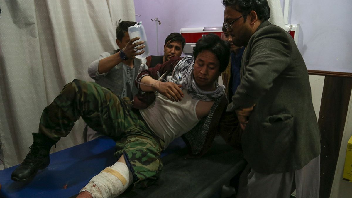 A wounded man receives treatment in a hospital following a suicide bomber blew himself up in an education centre, in Kabul on October 24, 2020.