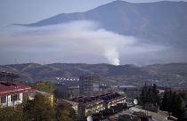 Smoke rises after shelling by Azerbaijan's artillery during a military conflict in Stepanakert, the separatist region of Nagorno-Karabakh, Saturday, Oct. 24, 2020.