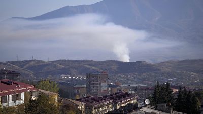 Smoke rises after shelling by Azerbaijan's artillery during a military conflict in Stepanakert, the separatist region of Nagorno-Karabakh, Saturday, Oct. 24, 2020. 