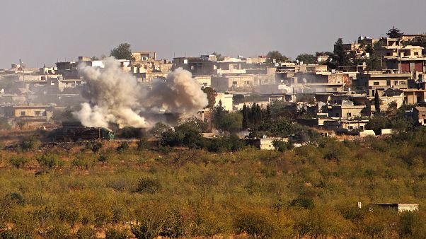 أرشيف- الدخان يتصاعد من أبنية في قرية كنصفرة بريف إدلب الجنوبي الخاضع لسيطرة الثوار شمال غربي سوريا. أرشيف- الدخان يتصاعد من أبنية في قرية كنصفرة بريف إدلب الجنوبي الخاضع لسيطرة الثوار شمال غربي سوريا.
