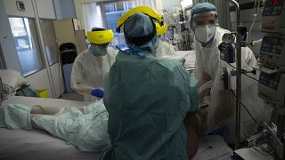 Medical staff work in the intensive care ward for COVID-19 patients at the CHR Citadelle hospital in Liege, Belgium, Wednesday, Oct. 21, 2020.