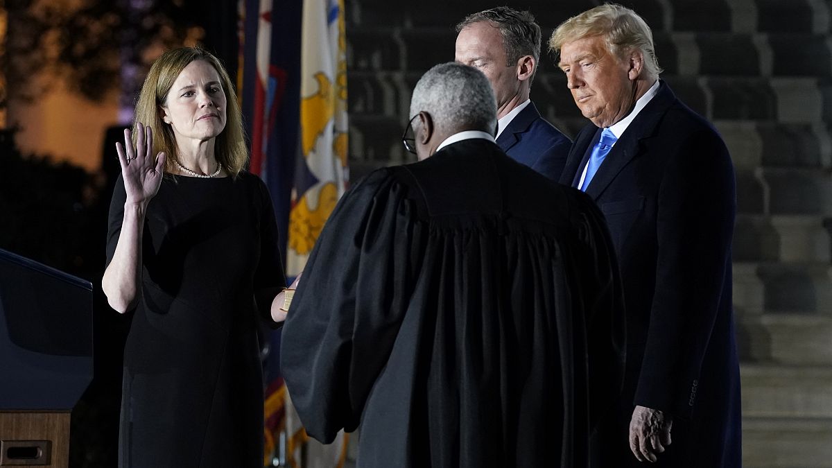 President Donald Trump watches as the Constitutional Oath is administered to Amy Coney Barrett at the White House in Washington, Ocober 26, 2020.