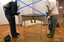 Des électeurs aux urnes à l'hôtel de ville de Boston lors du vote anticipé, le 26 octobre 2020