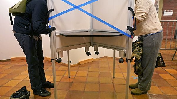 Des électeurs aux urnes à l'hôtel de ville de Boston lors du vote anticipé, le 26 octobre 2020 Des électeurs aux urnes à l'hôtel de ville de Boston lors du vote anticipé, le 26 octobre 2020
