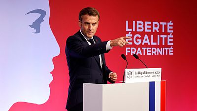 French President Emmanuel Macron delivers a speech to present his strategy to fight separatism, Friday Oct. 2, 2020 in Les Mureaux, outside Paris.