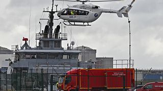 A French rescue helicopter lands close to a rescue vessel in Dunkirk, northern France, Tuesday, Oct. 27, 2020.