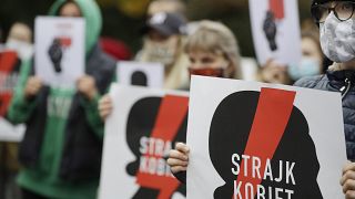 Women's rights activists protest against recent tightening of Poland's restrictive abortion law in front of the parliament building  in Warsaw, Poland, on Oct. 27, 2020.