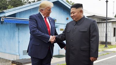 In this June 30, 2019, file photo, President Donald Trump shakes hands with North Korean leader Kim Jong Un in the Demilitarized Zone, South Korea.