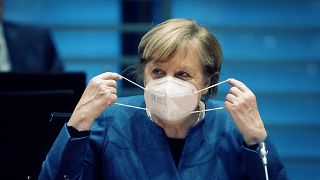 German Chancellor Angela Merkel wears a face mask as she arrives for the weekly cabinet meeting at the Chancellery in Berlin, Germany, Wednesday, Oct. 28, 2020.