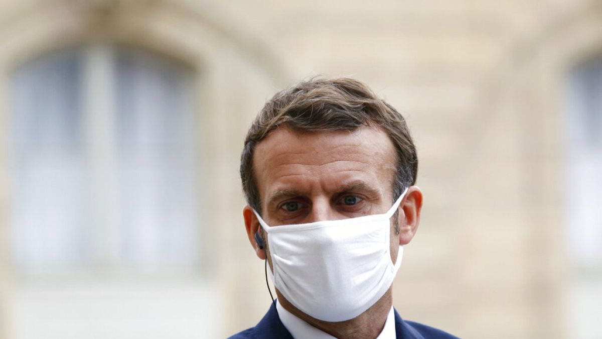 France's President Emmanuel Macron wears a mask during a speech of Estonia's Prime Minister Juri Ratas, at the Elysee Palace, in Paris