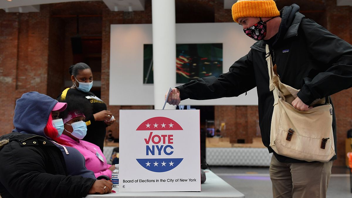 A voter drops off his early voting ballot for the 2020 Presidential election at the Brooklyn Museum in New York City on October 30, 2020. 