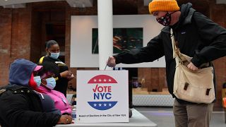 A voter drops off his early voting ballot for the 2020 Presidential election at the Brooklyn Museum in New York City on October 30, 2020.
