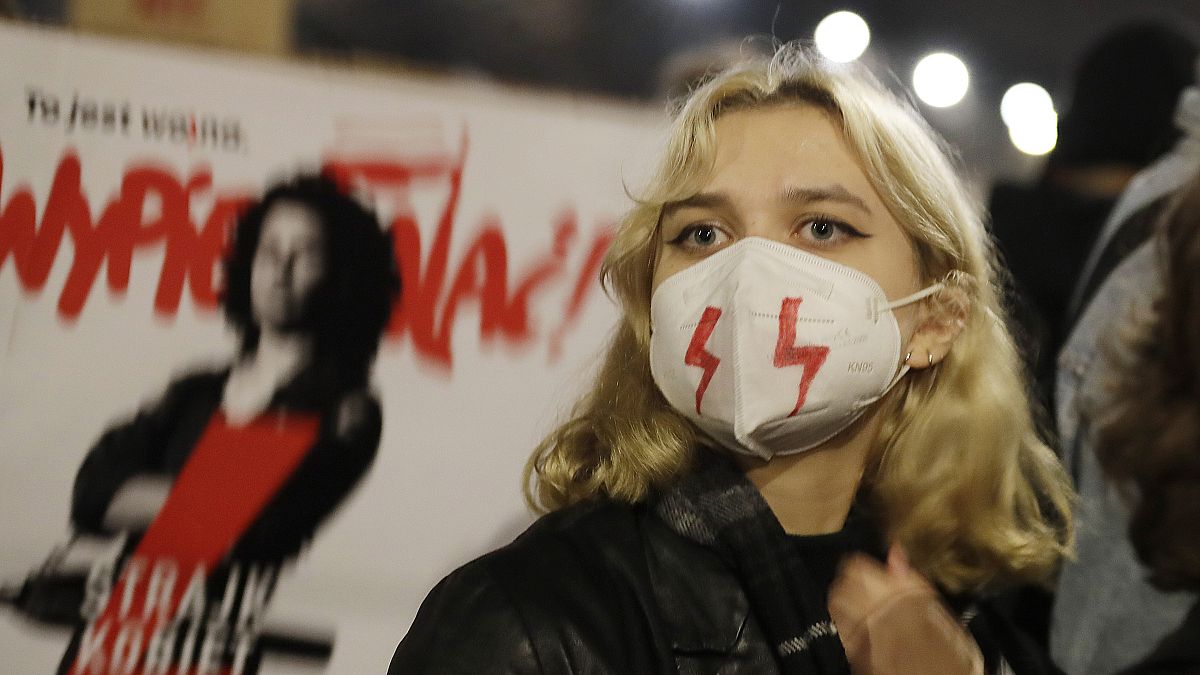 Young people take part in one of several protests against the conservative government triggered by a tightening of the abortion law, Warsaw, Poland, Friday, Oct. 30, 2020.
