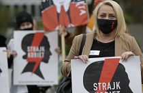 Women's rights activists with posters of the Women's Strike action protest against recent tightening of Poland's restrictive abortion law.