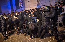 Violent clashes in Barcelona after authorities introduce strict new lockdown restrictions