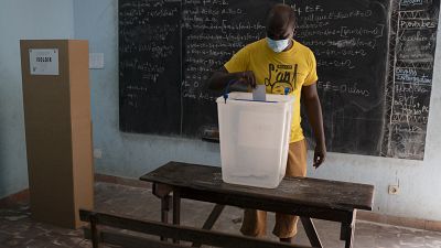 A man casts his vote during presidential election in Abidjan, Ivory Coast, Saturday, Oct. 31, 2020