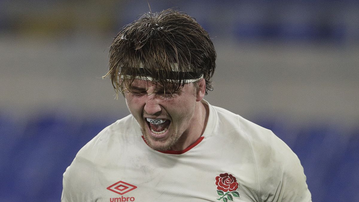 England's Tom Curry celebrates after scoring a try during the Six Nations rugby union international match between Italy and England at the Olympic Stadium in Rome, Italy,