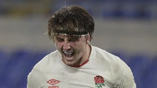 England's Tom Curry celebrates after scoring a try during the Six Nations rugby union international match between Italy and England at the Olympic Stadium in Rome, Italy,