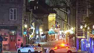 Police cars block the Saint-Louis Street near the Chateau Frontenac early Sunday, Nov. 1, 2020 in Quebec City