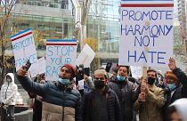 Canadian muslims holding signs