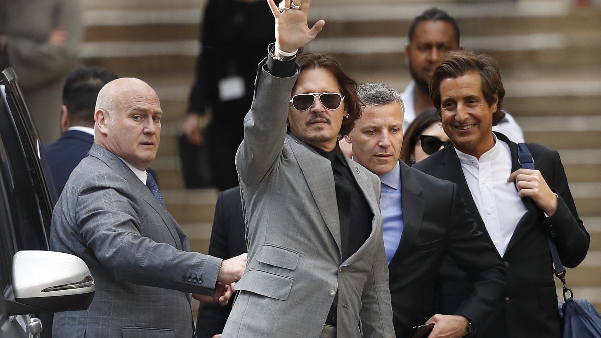 Johnny Depp was suing The Sun for an article that called the star a 'wife beater'