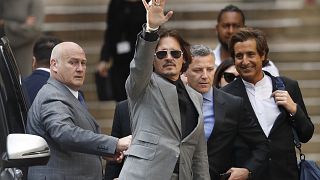 Johnny Depp was suing The Sun for an article that called the star a 'wife beater'