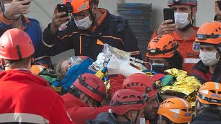 Rescue workers carry four-year-old girl Ayla Gezgin who was buried under rubble for 91 hours following the earthquake