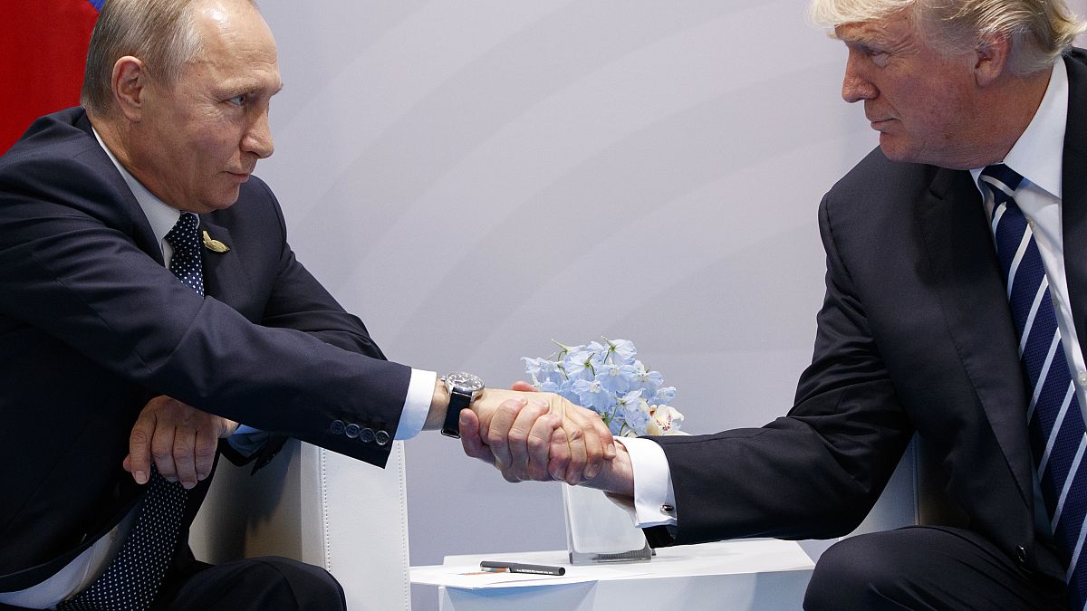In this July 7, 2017, file photo, US President Donald Trump shakes hands with Russian President Vladimir Putin at the G20 Summit in Hamburg