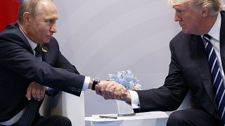 In this July 7, 2017, file photo, US President Donald Trump shakes hands with Russian President Vladimir Putin at the G20 Summit in Hamburg