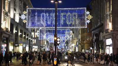 Shoppers make their way along Oxford Street in central London