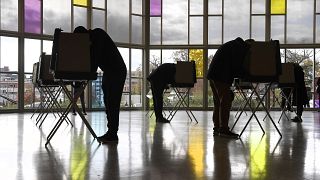 Voters mark their ballots at First Presbyterian Church on Election Day in Stamford, Connecticut