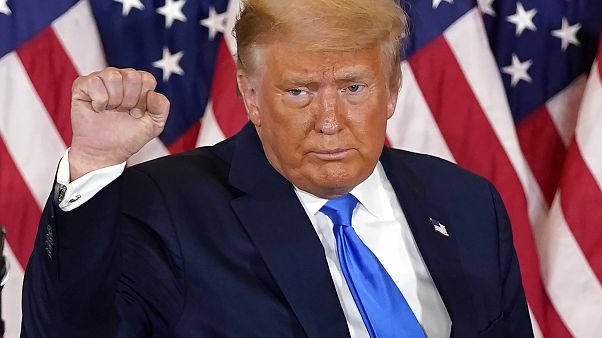 President Donald Trump pumps his fist after speaking in the East Room of the White House, early Wednesday, Nov. 4, 2020, in Washington.