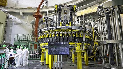 personnel work to begin loading nuclear fuel at Belarus' first nuclear plant which was built by Russia's state nuclear corporation Rosatom