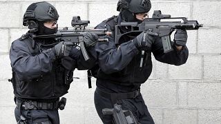 Police officers hold weapons during a training operation of the new BFE+ (Evidence and Arrestment) unit of the German federal police in Ahrensfelde near Berlin, Germany, Thurs