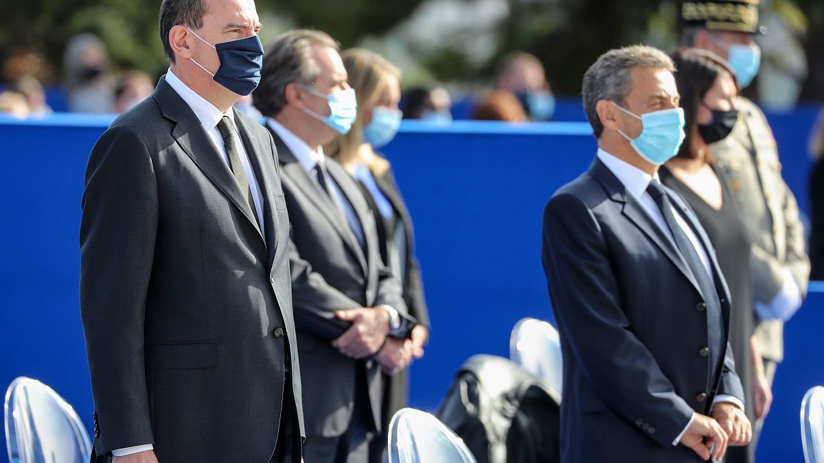French Prime Minister Jean Castex (L) and former French president Nicolas Sarkozy (R) attend a ceremony in Nice, on November 7, 2020