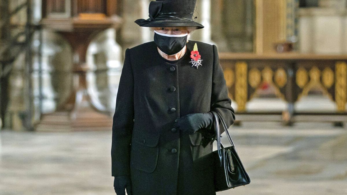 Britain's Queen Elizabeth II attends a ceremony to mark the centenary of the burial of the Unknown Warrior, in Westminster Abbey, London, Wednesday, Nov. 4, 2020. 