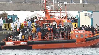 Migrants on an emergency services boat