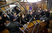 People crash a construction as they broke into the government building protesting against an agreement to halt fighting over the Nagorno-Karabakh region, in Yerevan, Armenia