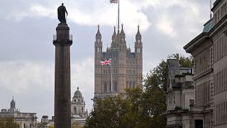 A Union flag flies atop the the Victoria Tower at Britain's Houses of Parliament, incorporating the House of Lords and the House of Commons, in London on October 20, 2020. 